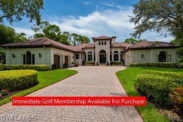 Impeccably remodeled estate home in prestigious Grey Oaks overlooking lake & preserve of the 17th ho