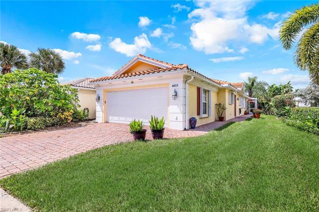 This is the one you've been waiting for!  Fabulous "Capri" villa in the highly desirable Island Walk neighborhood in North Naples.  This beautiful, move-in ready villa has a newer roof & gutters (2020), hurricane proof front door, accordion hurricane shutters, granite counters in the kitchen, baths & laundry, pull-out drawers in the kitchen and laundry, newer exterior paint (2018), newer water heater (2018) and a new washer and dryer (2023). Outside is an extended tiled lanai with a hot tub, pergola & covered outdoor area w/built-in granite counters w/white cabinetry and a preserve view of a beautiful garden. Other features include stainless steel appliances, plantation shutters, tile & luxury vinyl flooring, walk-in tub w/jets & heater in primary bathroom, built-in storage cabinets in the laundry room & garage and central vac. Island Walk is a resort-style community with no CDD, low fees, town center clubhouse with state of the art fitness center, two community pools, tennis & pickle ball, putting green, bocce courts, gas station, car wash, hair & nail salon, post office and on-site restaurant. Close to beaches, shopping, restaurants, hospitals and convenient to SWFL Airport!