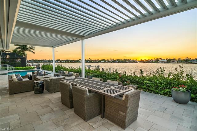 Nestled on a rare coveted Royal Harbor Kingfish open bay waterfront lot, this exquisitely renovated 