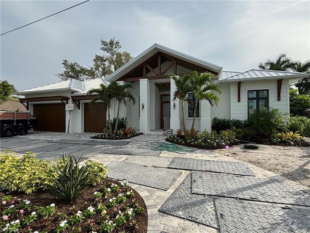 The must-see benchmark in Floridian opulence.Nestled in the highly sought-after The  Moorings, this 