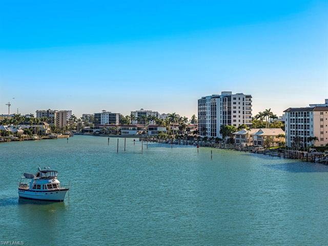 Beautiful Panoramic view of Moorings Bay!  This end unit condo has stunning water views from every r
