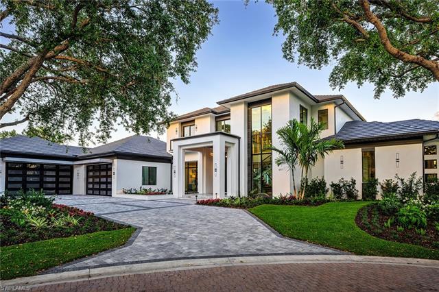 Crafted by BHG Development, this Pelican Bay estate in Naples, FL, features the prestigious architec