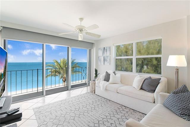 Enjoy life at the beach in Naples! This light and bright two-bedroom, two-bath end unit in Carriage 