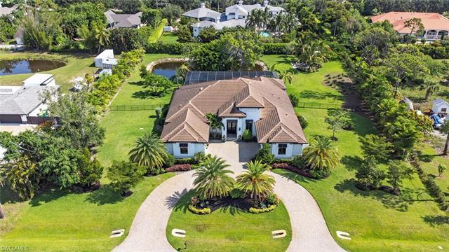 179 Mahogany Dr., a magnificent residence located in the prestigious Pine Ridge Estates. Situated on
