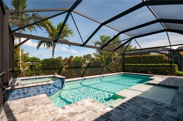 VIEWS, VIEWS VIEWS! This spacious two+den Isles of Collier Preserve home is situation on a beautiful