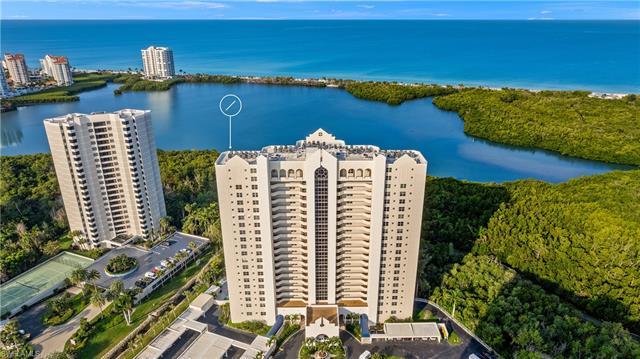 Tranquil treetop views await you from this 3 bed/2 bath condo in St. Nicole at Pelican Bay. This wes