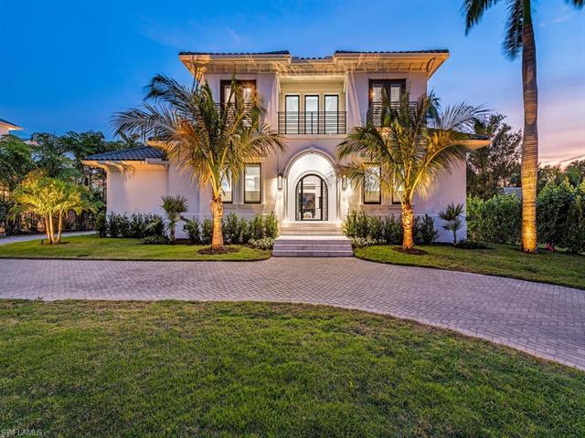 Built on beautiful Bahia Point this stately residence exudes coastal charm after undergoing a tastef