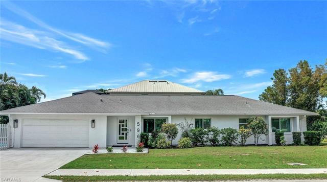 Contemporary white & bright airy pool home in the 500 block completely updated with double car garag