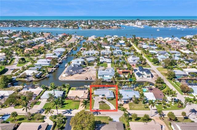The best priced waterfront home in Naples! Incredible opportunity to build or develop the home of yo