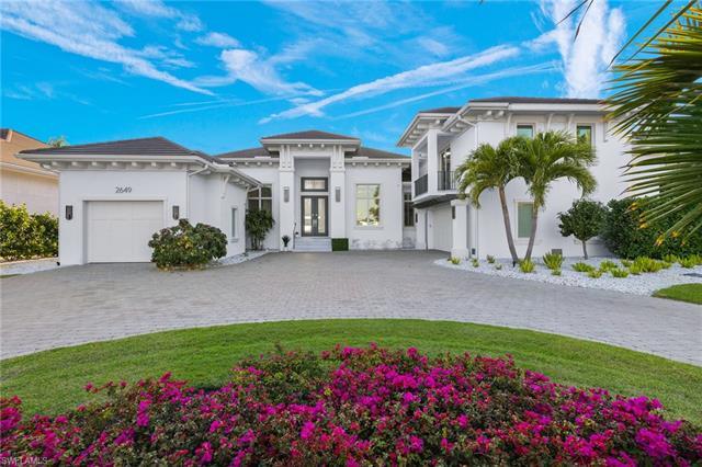 Welcome to 2649 Tarpon Road in prime Royal Harbor location boasting 100 feet of stunning Naples Bay 