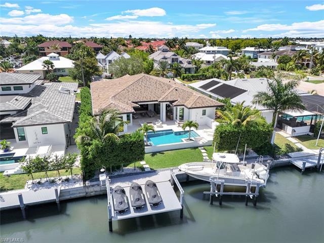 Experience luxury waterfront living in this captivating 4 bedroom, 4.5 bathroom, 2.5-year-new home t