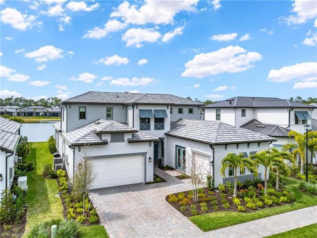 Savor awe-inspiring Southwest Florida sunsets from this western-facing lake and fountain-view home. 