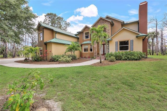 Welcome to your dream oasis! Nestled on a sprawling 2.72-acre lot, this ranch-style two-story single