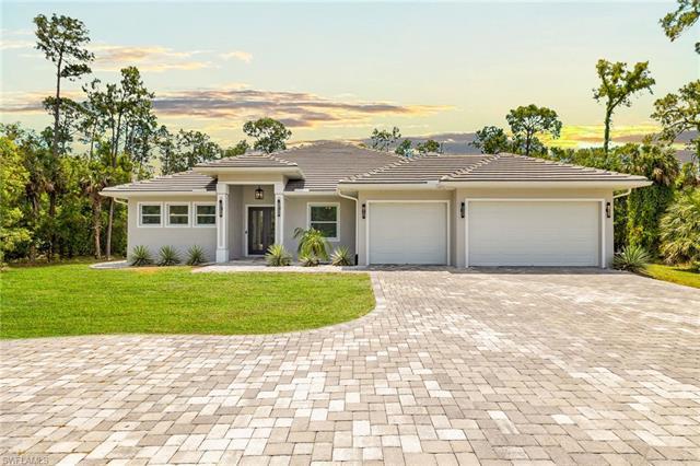 Welcome home to luxury living in Collier Woods Estates! This masterful home boasts a warm & comforta