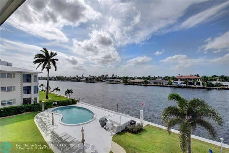 A PIECE OF HEAVEN YOURS TO ENJOY! A BOAT PARADE EVERY DAY! THIS 2B/2B DIRECT INTRACOASTAL FRONT CONDO IS MOVE-IN READY. REMODELED KITCHEN, TILED THROUGHOUT (SANDY FEET NO PROBLEM), L-SHAPE LIVING/DINING AREA, REMODELED MASTER & GUEST BATHS, CROWN MOLDING, 8 YEAR SAFETY GLASS PLUS ELECTRIC SHUTTERS AT SCREENED WINDOWS/DOORS, HARD-WIRED FIRE ALARM, NEW A/C, FIRE PIT SEATING  WHERE YOU CAN ENJOY OCCASIONAL COOL EVENINGS ...NOTHING IS LEFT TO CHANCE. SO CLOSE TO THE BEACH, YOU CAN ALMOST HEAR THE OCEAN. WITH THE NEW POMPANO PIER, UP-SCALE RESTAURANTS, HOTELS, SHOPPING, & THE MULTI-MILLION DOLLAR, WORLD CLASS LUXURY MARKET EXPANSION IN PLACE, POMPANO BEACH IS THE HAPPENING PLACE. THE TIME IS NOW TO BUY AND ENJOY FLORIDA AT ITS BEST AT A PRICE YO