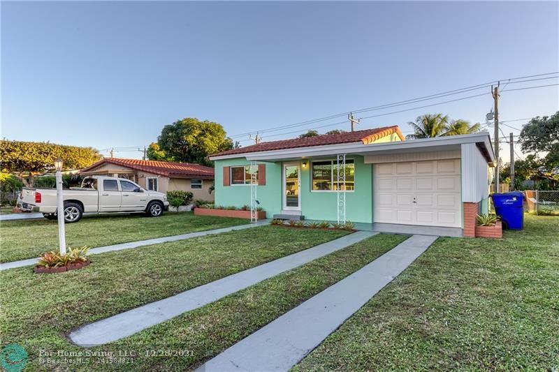 Renovated home in desirable section of Hollywood. Floor plan is very functional making the space feel larger and very open.  Stylish renovated bathroom.  Separate laundry room and Florida room add to the functional spaces of the home. Windows have all been replaced with impact windows.  Florida room has shutters.  Large yard.