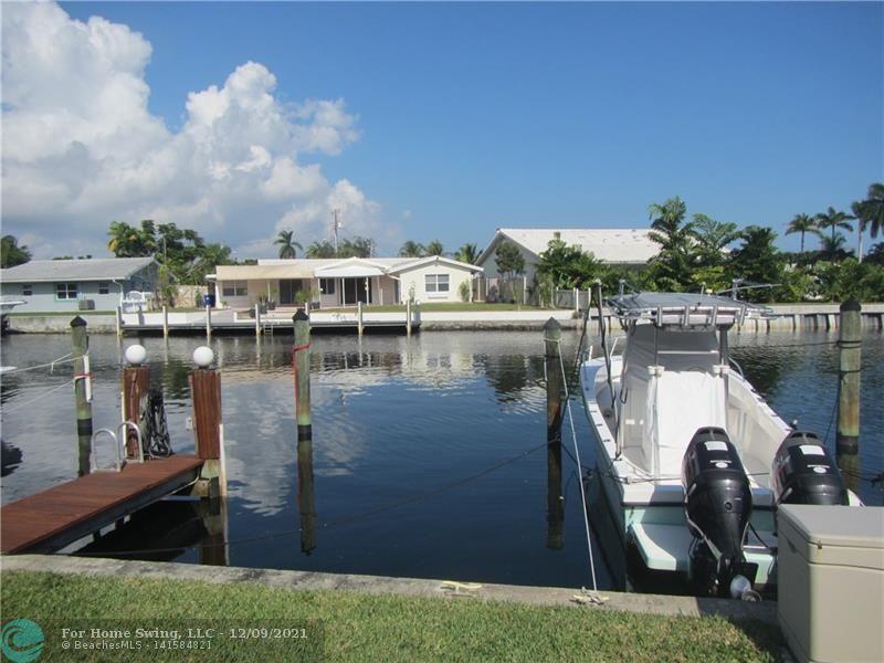 WATERVIEW & PRIVATE DOCK!!! Own this beautifully remodeled waterfront condo which includes a large boat slip on a lightly traveled ocean access canal, covered parking, 2 pets-20 lbs ok, no age restriction, breathtaking views of sparkling water, balcony front and back, laundry room in unit with full size washer and dryer.  Spotless, open and bright, freshly painted and ready for your personal touches.  Located in a pristine and immaculate gated community tucked inside a residential high end waterfront neighborhood.  Just minutes to the Atlantic Ocean either by boat or bike.   Offers submitted must include proof of funds.