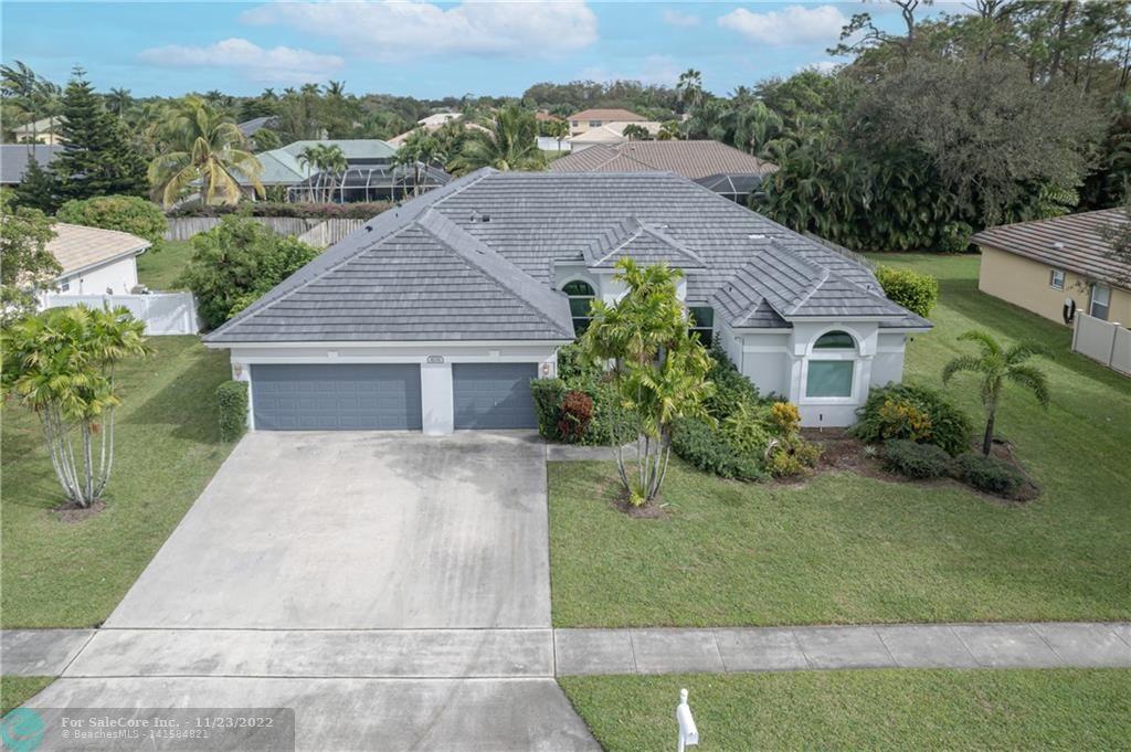 One of the most sought-after locations in western Lake Worth.  The home features over just over 2700 sq feet.  BRAND NEW ROOF 11/22.  The home has volume ceilings with a large living room & dining area, eat in kitchen w/ island & family room.  Split bedroom plans allow privacy for everyone.  3 car garage with storage space.  The large primary bedroom features two walk in closets and a large dressing room lined with shelves.  Dream storage for your shoes and clothes.  Totally remodeled primary bathroom features separate vanities, walk in shower, stand-alone tub, new tile, fixtures & mirrors.  The other two bathrooms have been remodeled with great style. Freshly painted exterior, Impact windows.  Large lot w/ pool for entertaining. great scho