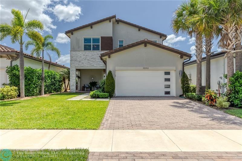 Live the South Florida lifestyle in this contemporary lakefront heated pool builder's model home in gated Andalucia community.  This 2019 home features 4 bedrooms, 3 bathrooms, loft area, outdoor entertainment area w/ grill, pool & hot tub.  The open living area has a built-in media center next to the gourmet kitchen w/ a waterfall quartz countertop island. Upgrades are recessed lighting throughout, gas range, upgraded cabinets in kitchen, bathrooms, double pantry & laundry room. Sono's ceiling speakers in Lania & main bedroom. Custom built ins in mudroom, family room, primary closet & outdoor grill w/ entertainment center.  This smart home features impact windows/doors, upgraded flooring & fixtures, wainscoting in foyer, stairway.  The gar