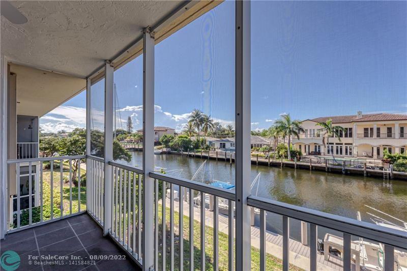 Make this waterfront 2 bedroom, 2 bath unit your own! Located in the hidden gem of Palm Aire at Coral Key in Lighthouse Point! From the moment you step in the unit you are greeted by beautiful water views & tons of natural light. This unit is spacious & offers a large living & dining room. The kitchen features a breakfast area, great natural light & has tons of potential to build your dream kitchen. Both bedrooms are en-suite, very spacious & offer multiple closets in each one to maximize storage throughout the unit. Impact windows & doors & full size washer/dryer in the unit! The large screened patio has direct canal views down to the Intracoastal Waterway. Palm Aire has rentable dockage when available, beautiful grounds, heated pool, club