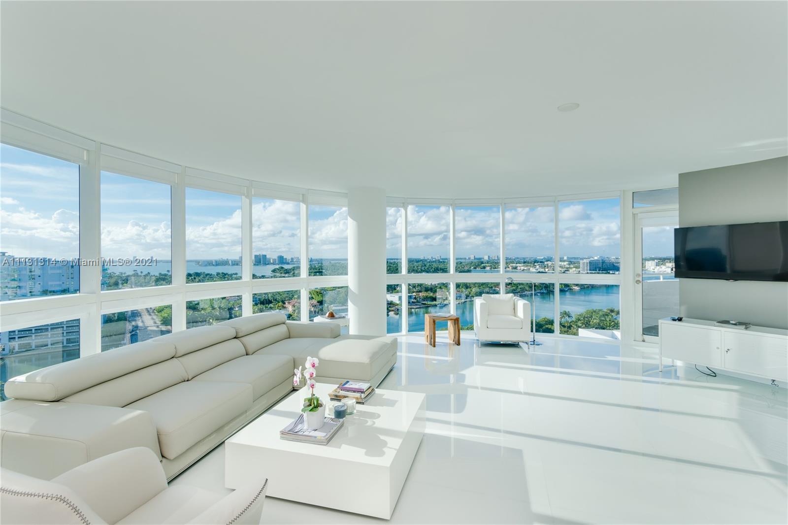 Amazing unit at La Gorce Palace, with 2 balconies, and a cristal view on this round glass living roo