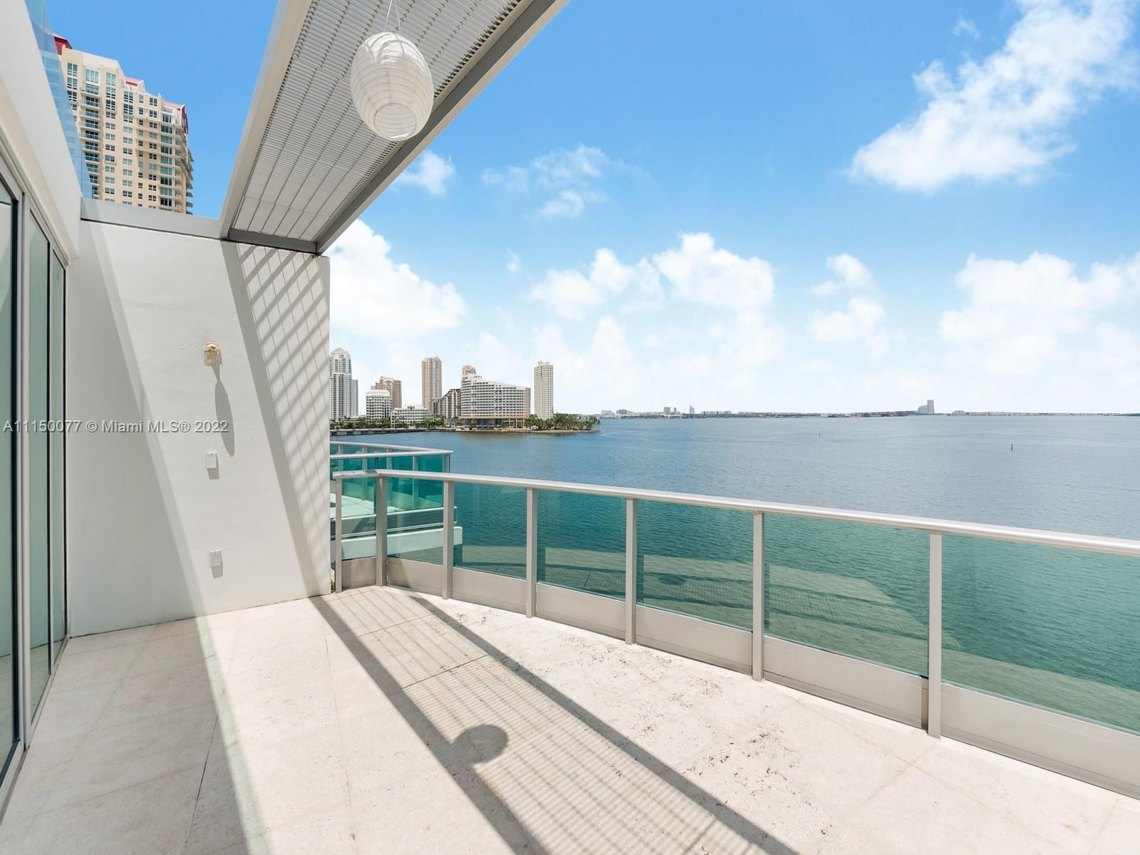 One of a kind direct bay views from every room in this three-level loft at the Jade. A spacious livi