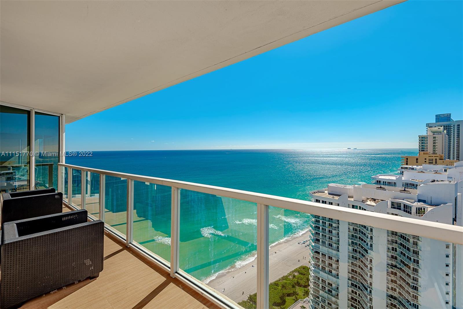 Stunning bright corner unit with Intracoastal and Ocean Views. Wraparound Balcony, floor-to-ceiling 