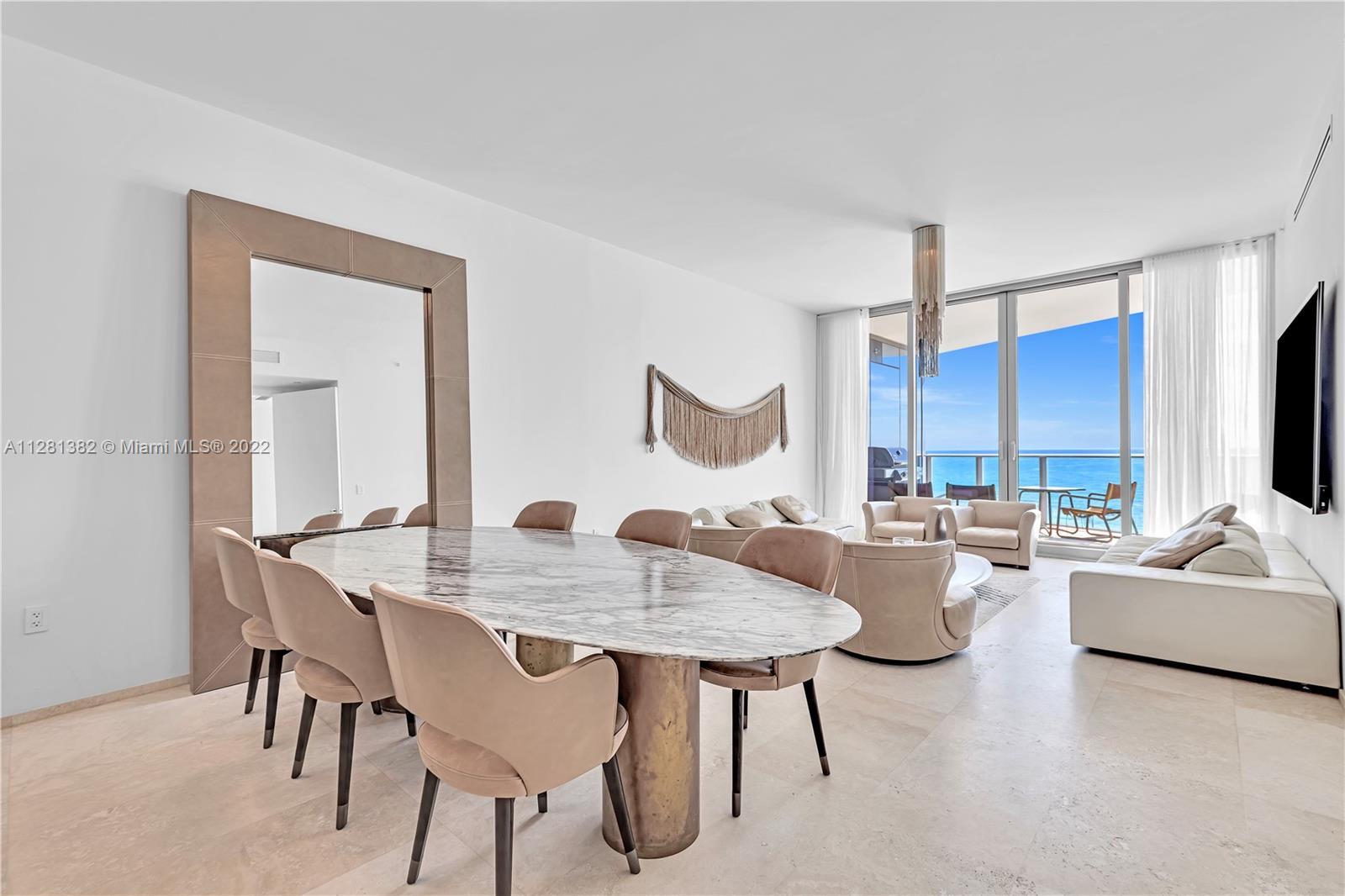 Luxury turnkey residence at The Ritz Carlton Sunny Isles finished with cream marble flooring & Baxte