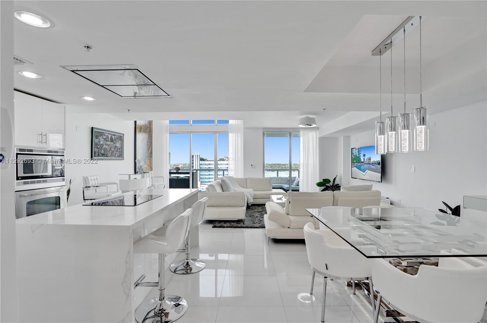 Rarely available 2 story lower penthouse loft in luxurious Eloquence on the Bay designed by award wi