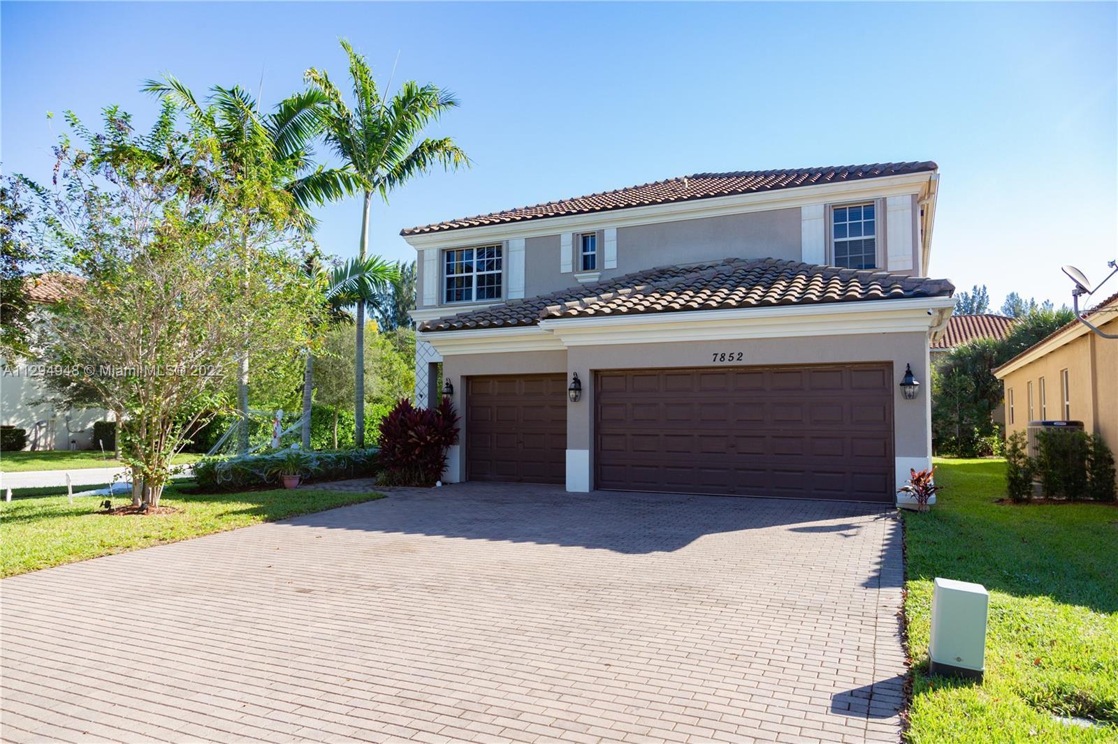 Enjoy Florida Living in full comfort with this beautiful & spacious corner lot home in a gated commu