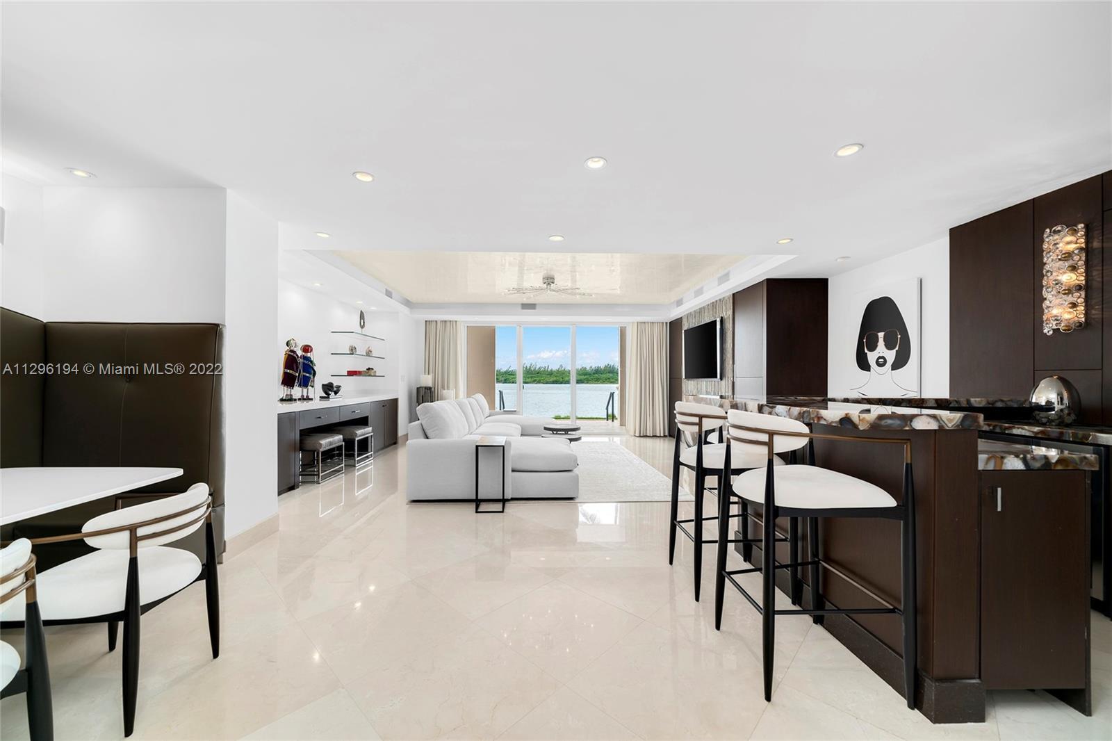 This immaculate ground floor Bayside Village unit features 3BR/3BA & 2,234 SF of custom designed int