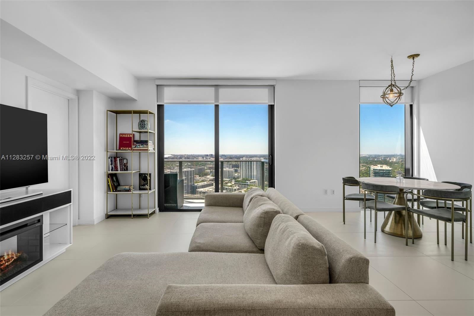 Enjoy gorgeous views and sunsets overlooking Midtown and Wynwood from this West facing 2 bed turnkey