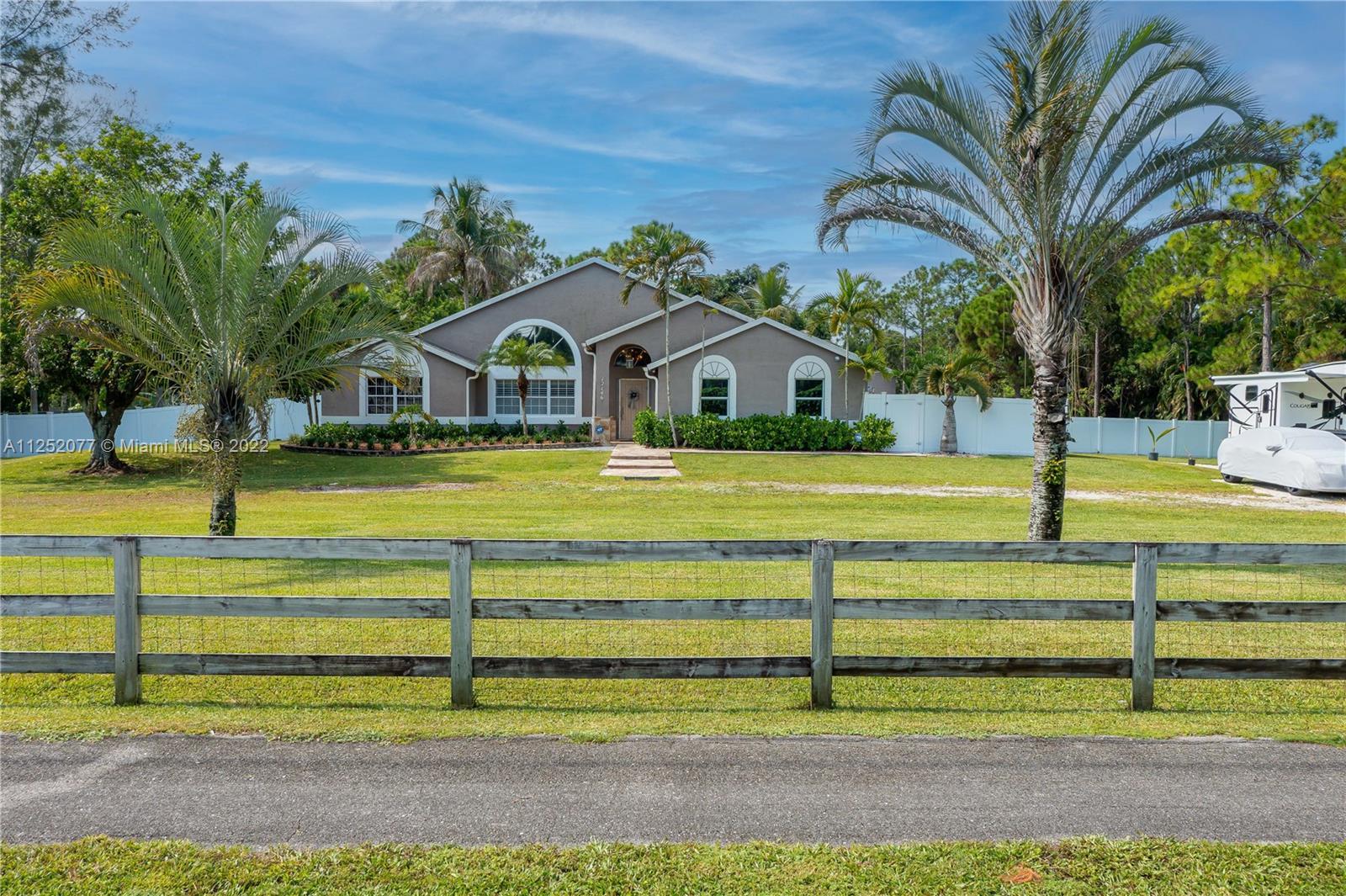 HUGE PRICE REDUCTION! Acreage Oasis, 4 Bed/2 bath + Den on a 1.64 Acre lot has ample room for everyo