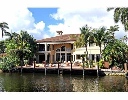 OUTSTANDING MEDITERRANEAN WATERFRONT ESTATE WITH 4 BEDROOMS, 5 & HALF BATHROOMS AND 4 CAR GARAGES. B
