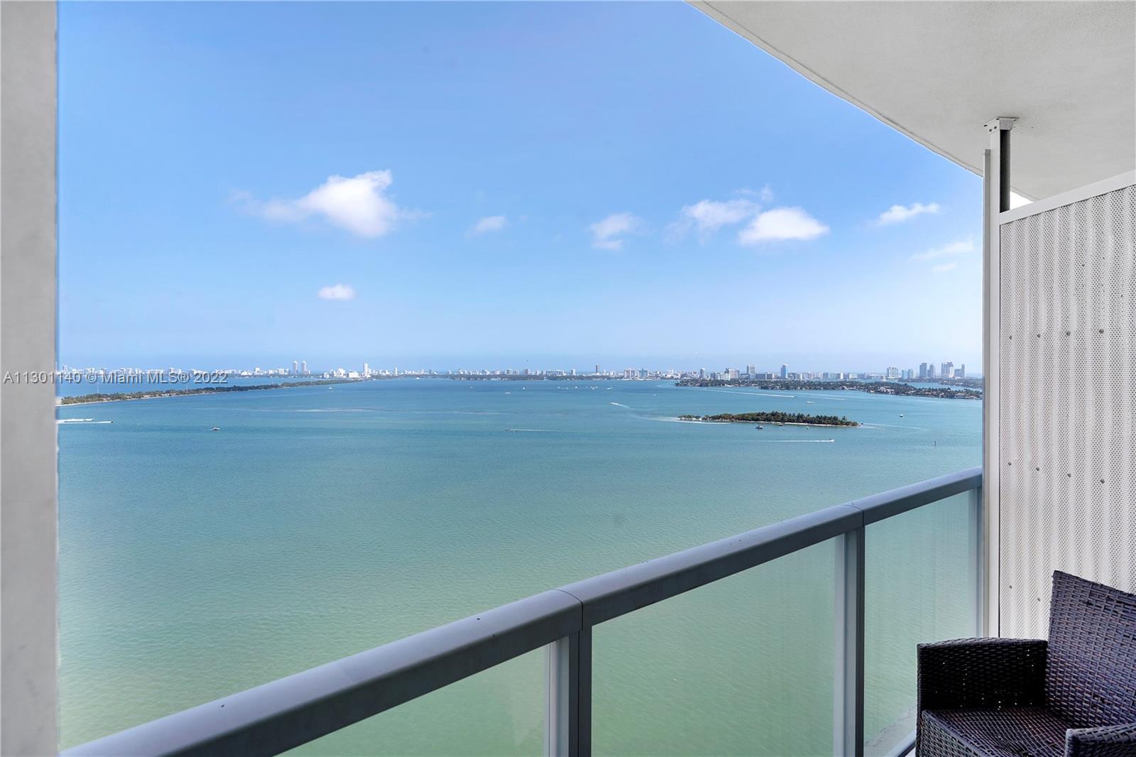 Bright bayfront condominium with beautiful, unobstructed views of the Intracoastal and Miami Beach. 