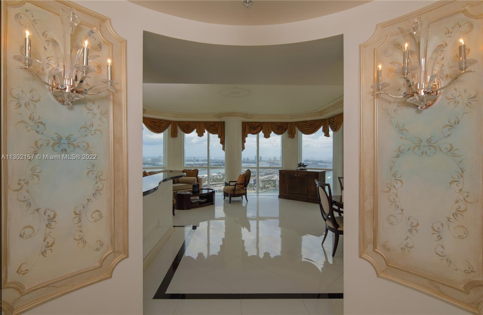 Unobstructed 180 water views, spectacular bay & ocean views, 2 balconies, ceiling glass, decorator f