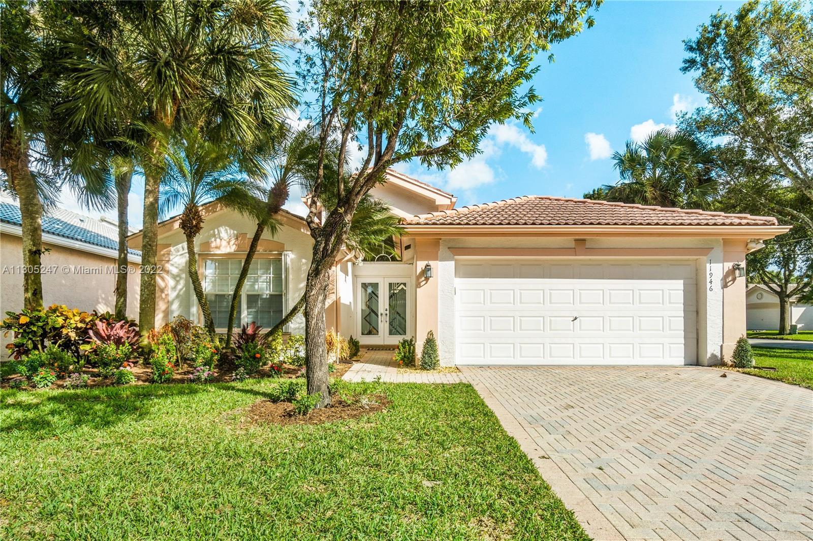 Located on a charming street inside the inviting Gated Community of Valencia Lakes, this beautifully