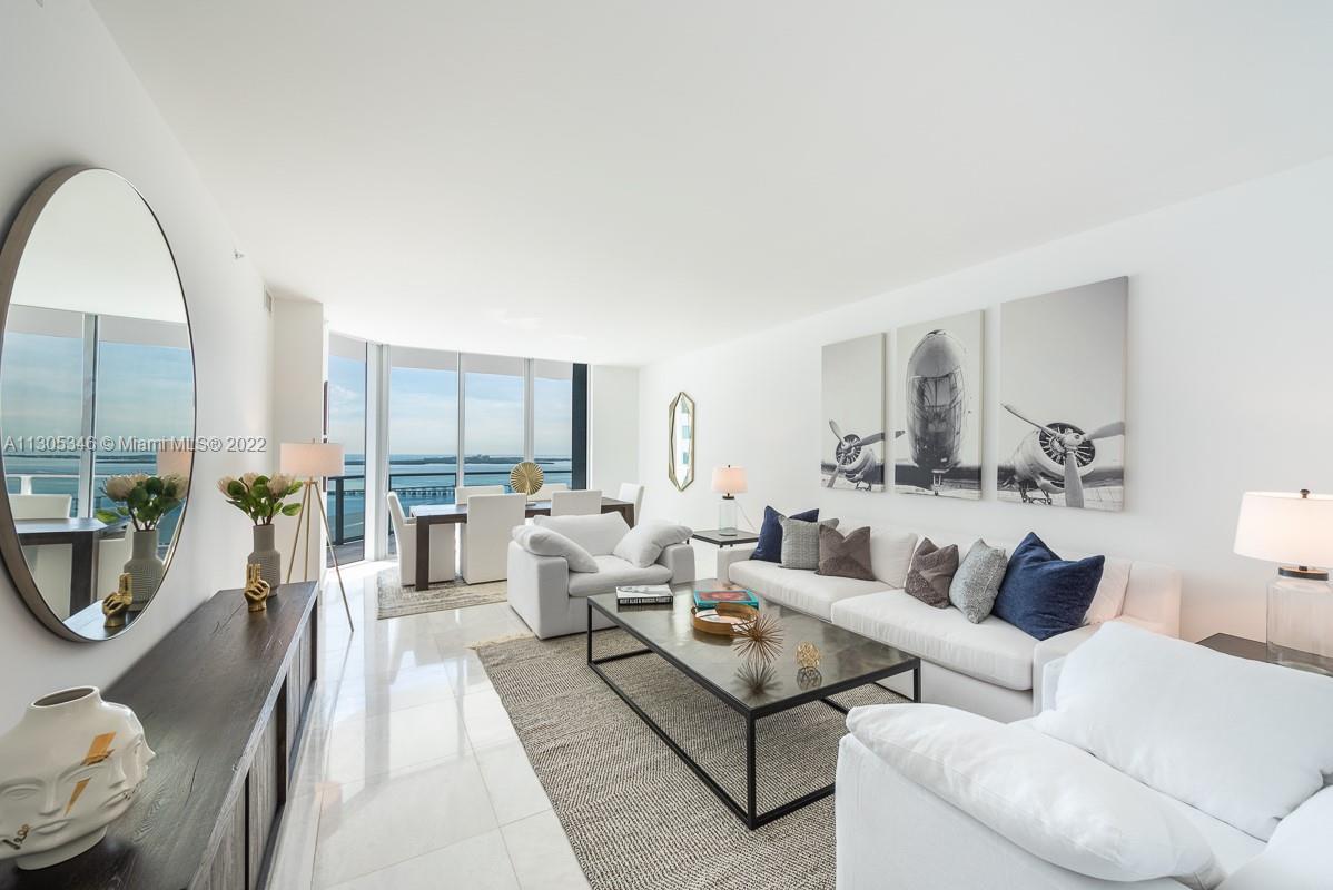 Stunning lower Penthouse provides 2365 sqft of pure bliss with mesmerizing bay & skyline views. This