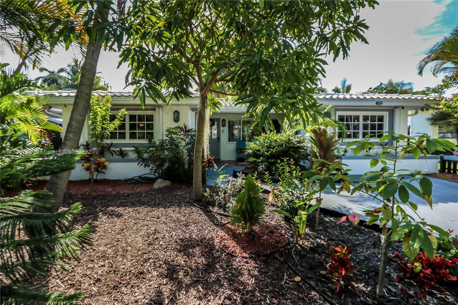 WELCOME TO YOUR TROPICAL OASIS! GORGEOUS 3 BED, 2 BATH HOME WITH ROOM FOR A POOL IN THE HEART OF HOL