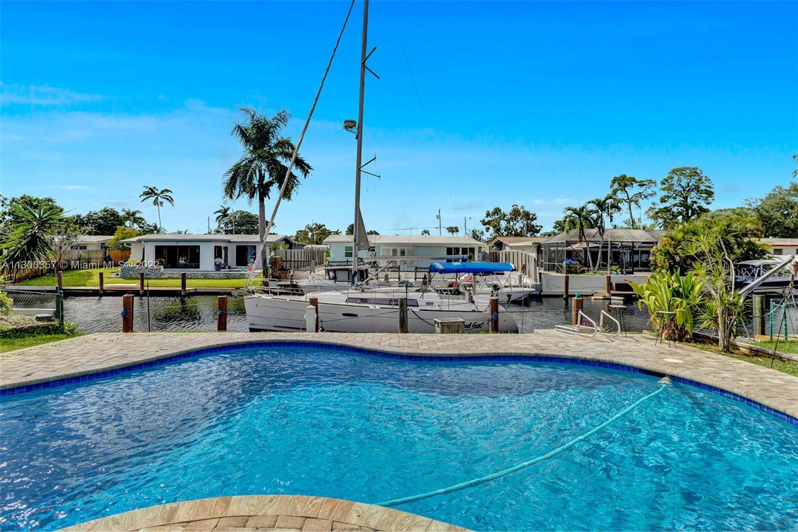 Boater's paradise home featuring direct ocean access with a large 64" Dock, deep water, no fixed bri