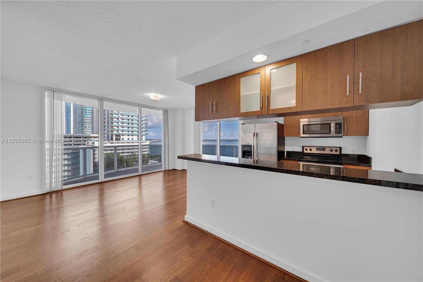Enjoy stunning Bay views from this Condo! Features 2 beds + 2 baths + Enclosed & Spacious DEN! Open 