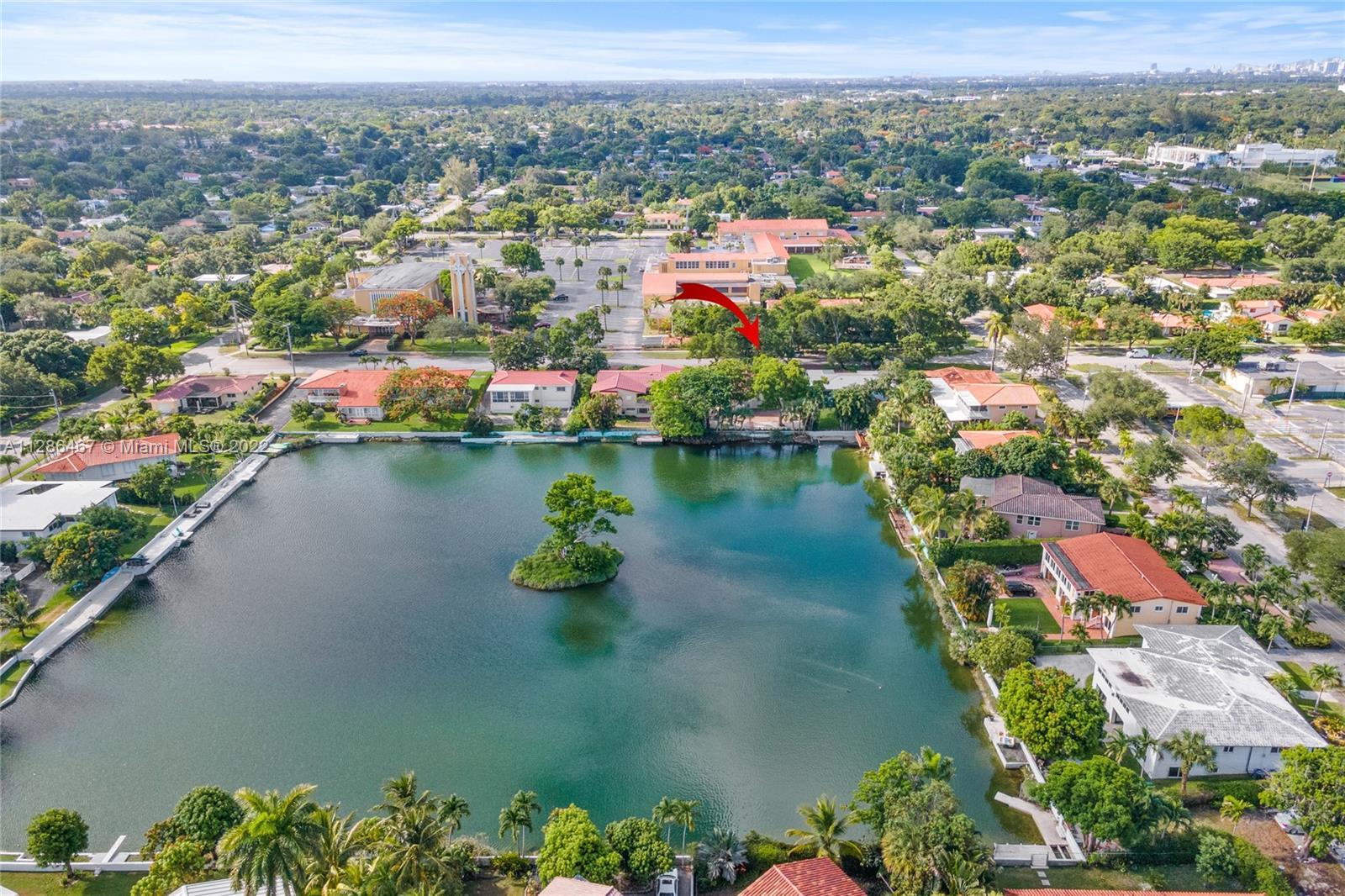 Welcome to your private updated oasis in desirable Miami Shores! Enjoy water views from every room i