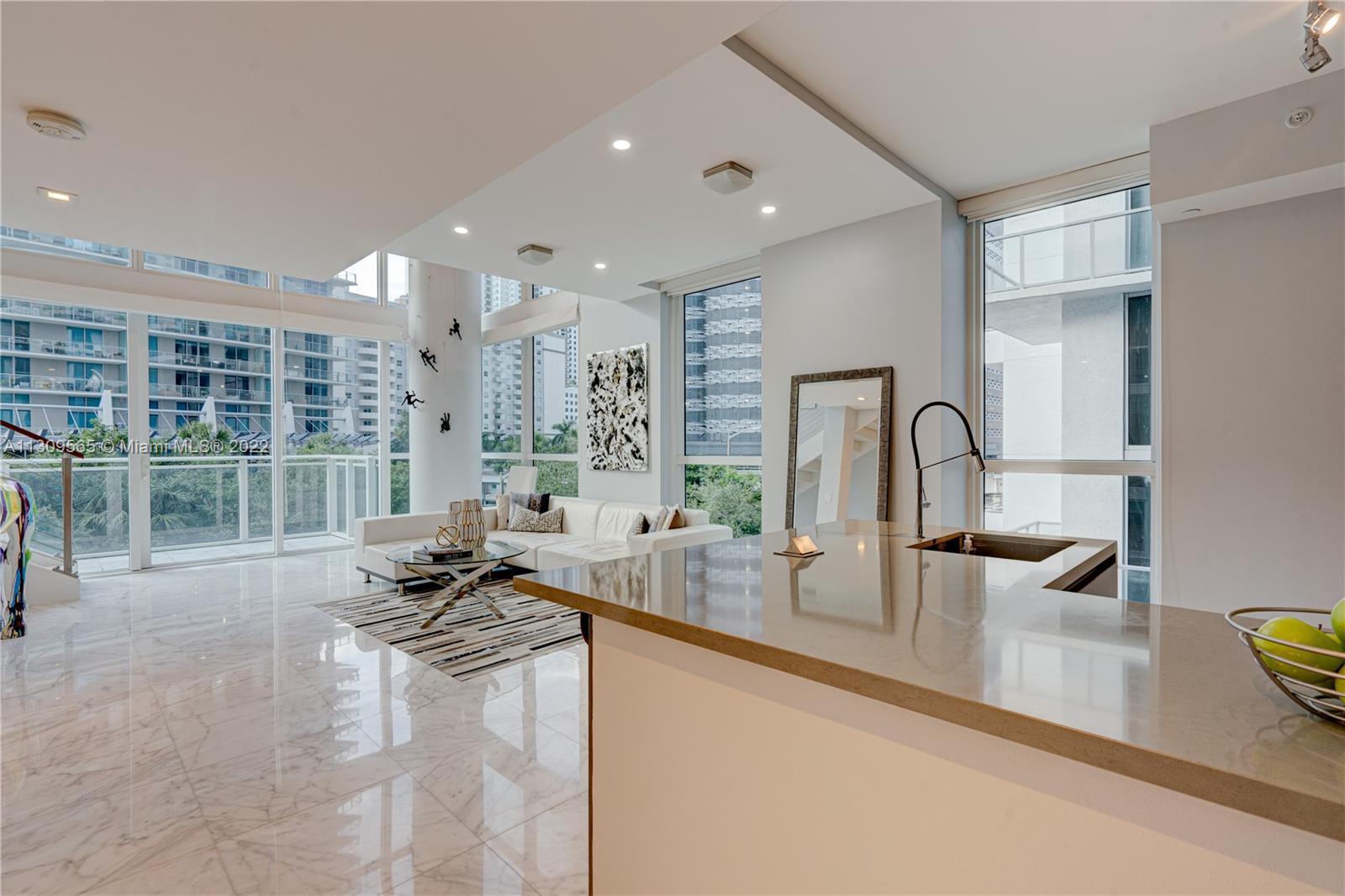 Beautiful corner unit with a view of the city! A 2-story, loft-style 1-bedroom, 1.5 -bathrooms unit 