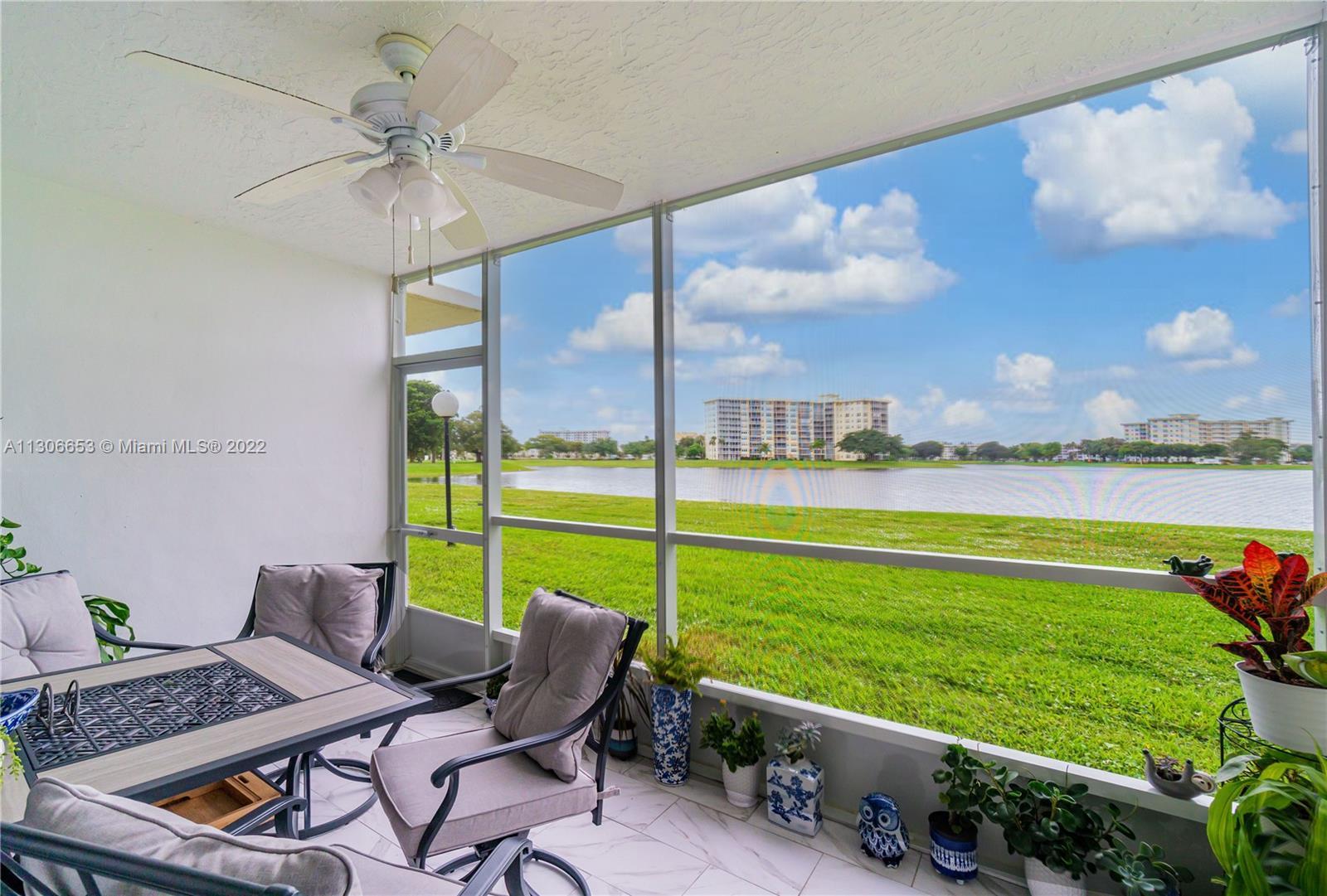 Enjoy A Beautiful Lake View From A Large Screened-In Patio In Your New Home. This First Floor Condo 