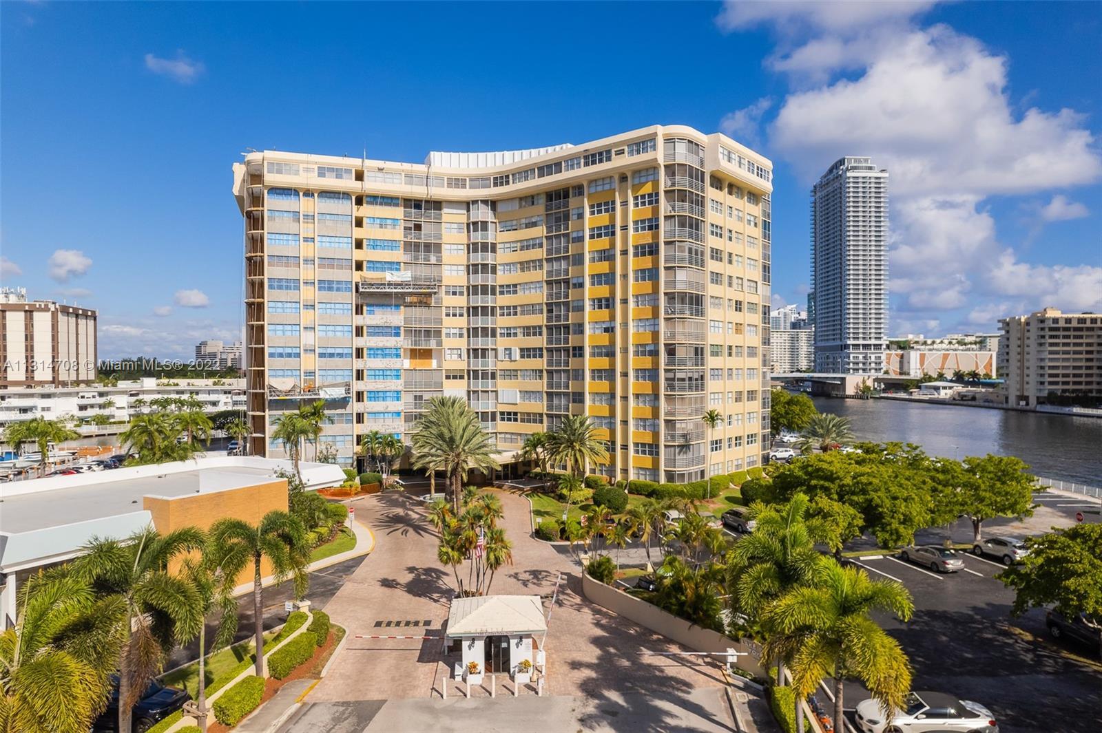 Classic Waterfront Style in this Mid-Century Modern High Rise!  On the tip of Golden Isles Drive, th