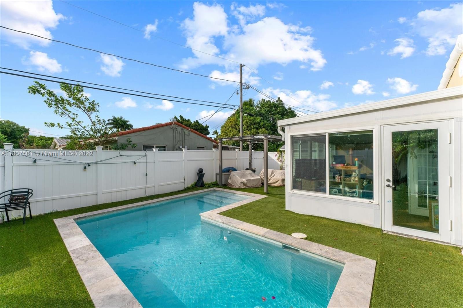 Beautiful corner property with a pool, 2.5 miles from the beach! This lovely 3 bed, 2 bath home is s
