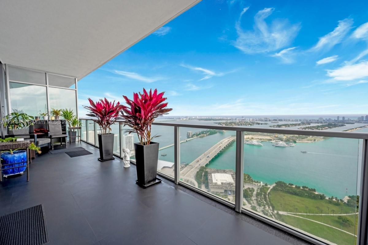 VIEWS, VIEWS AND VIEWS FROM THIS UNIQUE SOUTH CORNER RESIDENCE AT MARQUIS. ENTER THE FOYER THROUGH A