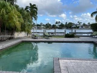 Rare Opportunity on Isle of Biscaya in Surfside- 8,000 SF lot with 50 LF of waterfront & pool. Just 