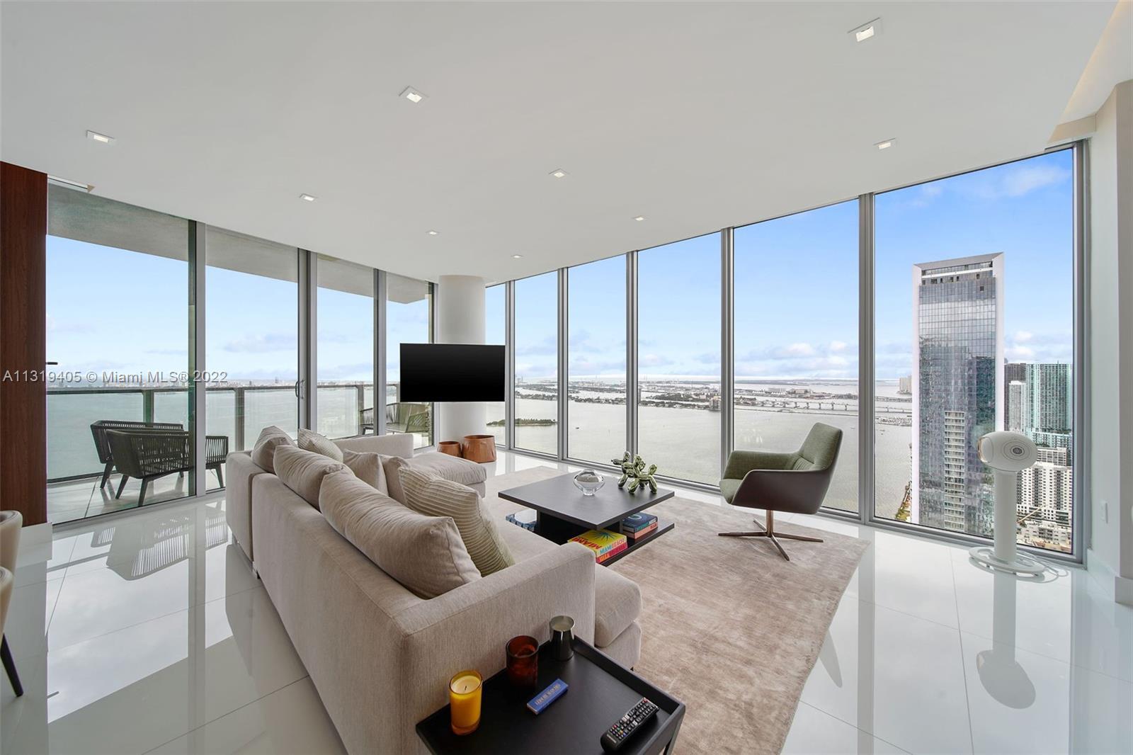 SPECTACULAR HIGH FLOOR BAY & SKYLINE VIEWS FROM THIS DESIGNER DESIGNED AND UPGRADED CORNER 3 BED + D