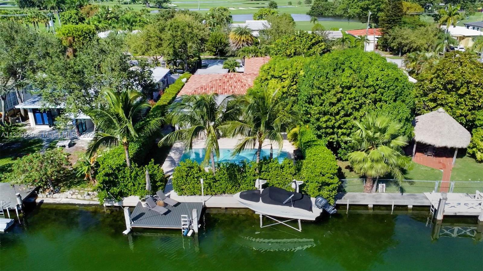 Mid-century modern Miami Beach waterfront home located on highly sought-after Normandy Shores Golf &